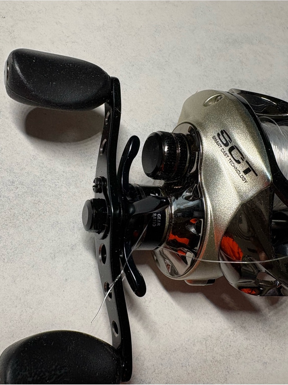 Bass Pro Shops Enigma Smart Cast Reel - Black and Gold - Picture 3 of 10